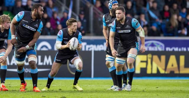 Centre of attention: Well, hes a scrum-half actually but Henry Pyrgos, ball in hand,  is very much the focus for his Glasgow team-mates as they prepare to face Cardiff at Scotstoun today. Picture: Gary Hutchison/SNS