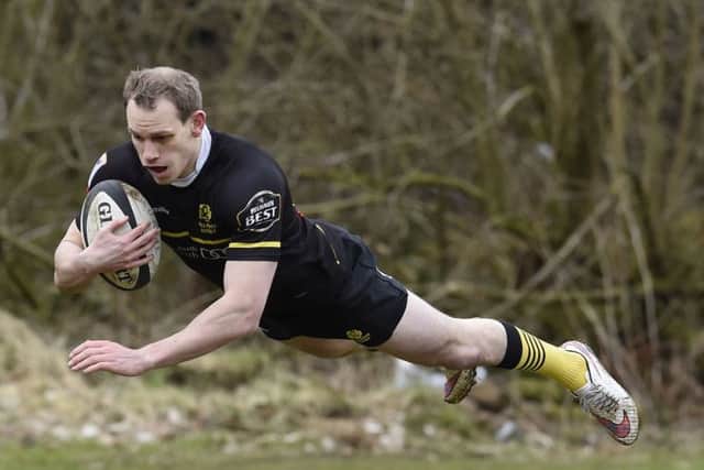 Fraser Thomson dives over to score the second Melrose try after cutting through the Currie defence. Photograph: Ian Rutherford