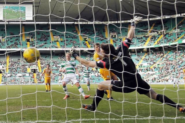 Celtics Gary Mackay-Steven puts the ball out of reach of stretching Morton goalkeeper Derek Gaston. Picture: PA