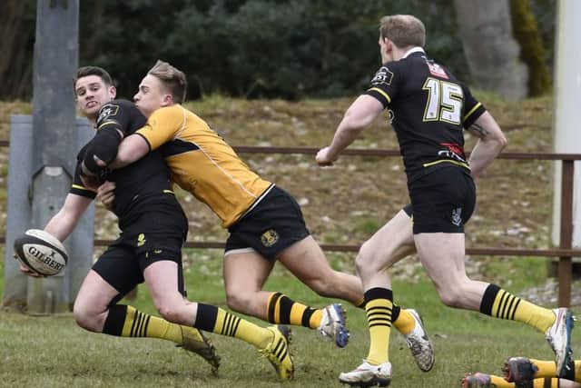 Curries Harvey Elms tackles Joe Helps as he offloads to Fraser Thompson who went on to score. Picture: Ian Rutherford