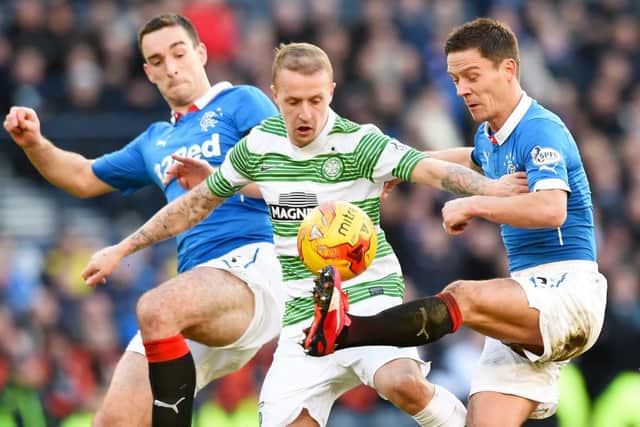 Celtic's Leigh Griffiths, centre, battles with Ian Black, right, and Lee Wallace of Rangers during last season's Old Firm League Cup semi-final. Picture: Craig Williamson/SNS