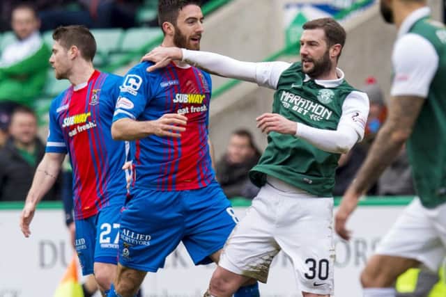 Inverness Caley Thistle's Ross Draper clashes with Kevin Thomson of Hibs. Picture: Alan Harvey/SNS