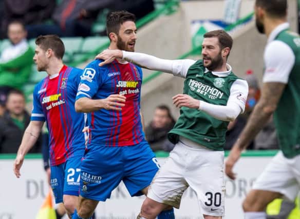 Inverness Caley Thistle's Ross Draper clashes with Kevin Thomson of Hibs. Picture: Alan Harvey/SNS