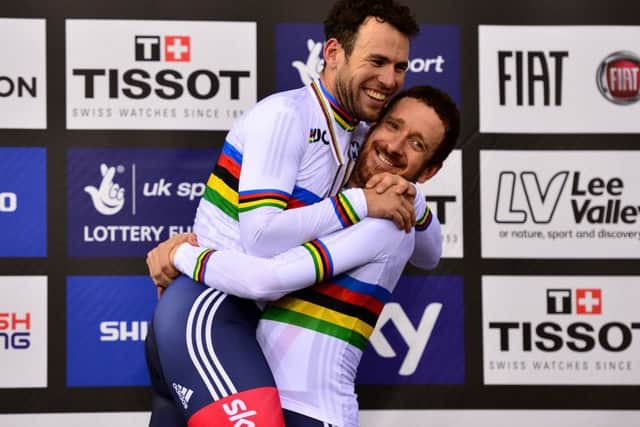 Sir Bradley Wiggins, right, lifts Mark Cavendish on the medal podium while, inset, Laura Trott celebrates her omnium victory. Picture: Getty Images