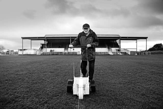 The Cliftonhill groundsman marks the pitch ahead of Albion Rovers' game against Montrose in January 2014. Picture: Iain McLean