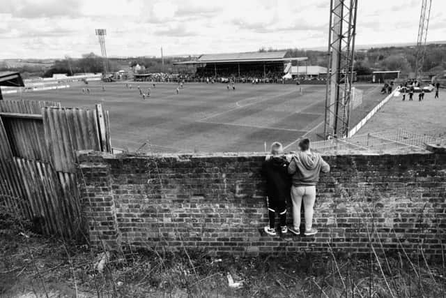 Two youngsters enjoy a free view of Albion Rovers' home match against Arbroath in May 2015, when the Coatbridge club were presented with the League Two trophy. Picture: Iain McLean