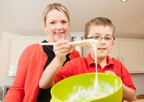 Josh Ferguson, 8 and Mum Elidh Mears make a cake to Josh's aunts Maureen MacKenzie. Picture: Toby Williams