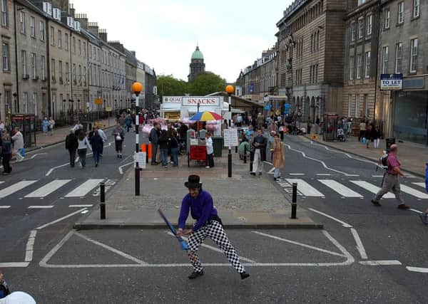 A children's entertainer performs on the car free day staged in George Street in 2003. Picture: Gareth Easton