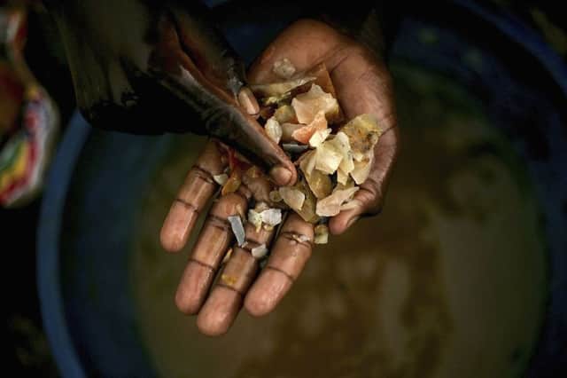 A boy looks for traces of gold at a mine in the DR Congo. Picture: Getty