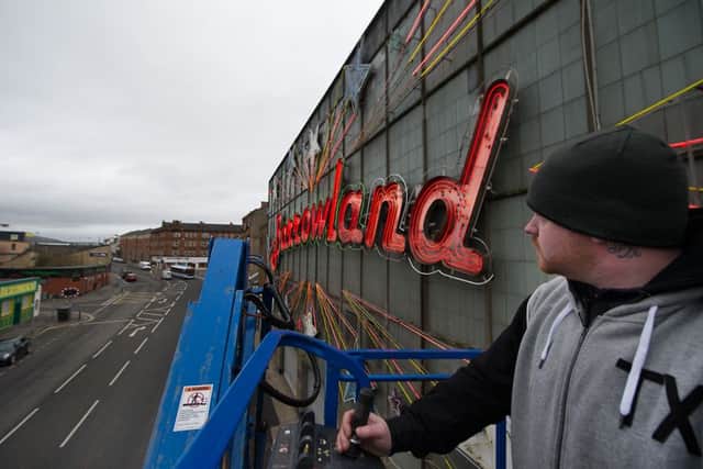 A workman carries out repairs to the iconic neon frontage of the Barrowland Ballroom in March 2016. Picture: John Devlin/TSPL