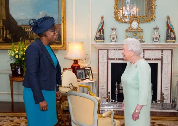 The Queen meets the High Commissioner for Antigua and Barbuda, Karen Mae-Hill, yesterday. Picture: Getty