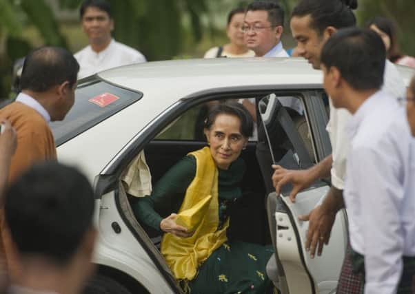 Aung San Suu Kyi arrives for a party meeting yesterday. Picture: AFP/Getty Images