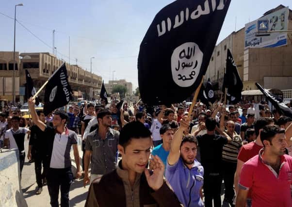 Pro-Islamic State demonstrators march in Iraq. Picture: AP