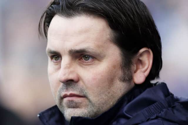 Paul Hartley watched his side lose heavily to Rangers. Picture: PA