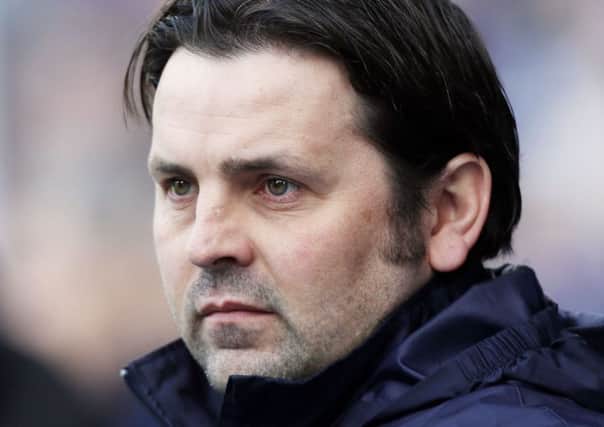 Paul Hartley watched his side lose heavily to Rangers. Picture: PA