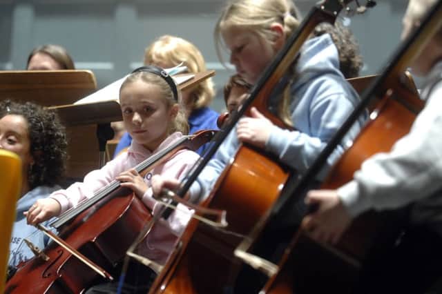 Young members of the Raploch Big Noise Orchestra playing in Edinburgh. Picture: Jane Barlow