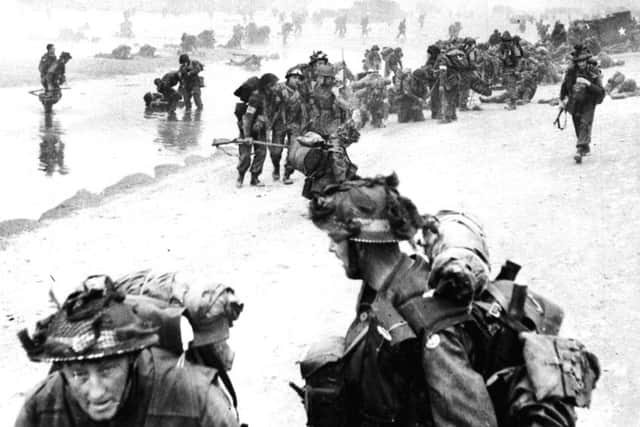 Allied troops arriving on a Normandy beach during the D-Day landings in June 6 1944 Picture: PA