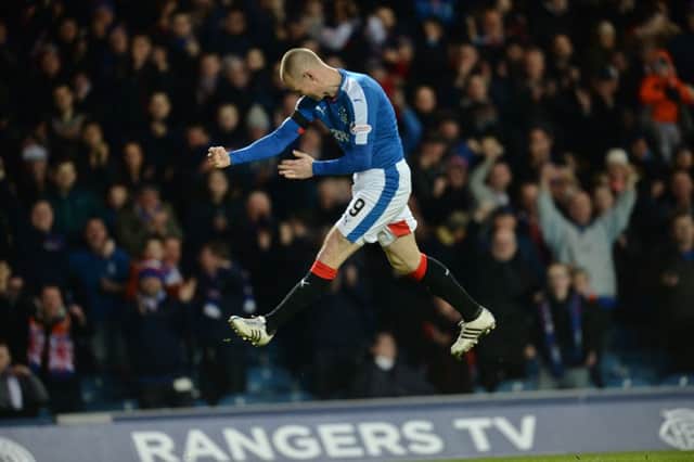 Kenny Miller celebrates netting one of his two strikes in Rangers' victory. Picture: SNS