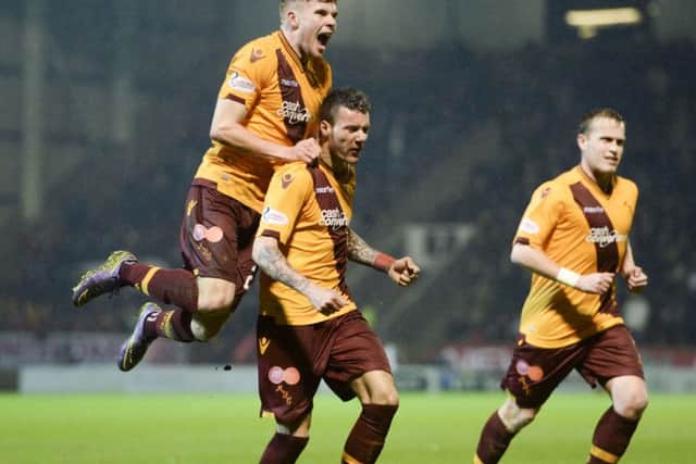 Motherwell's Marvin Johnson (centre) celebrates after scoring the equaliser. Picture: SNS