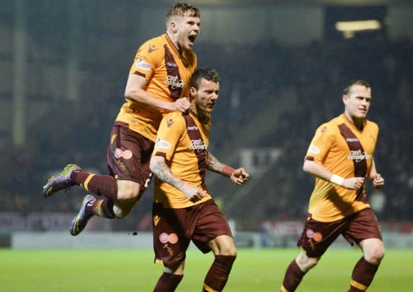 Motherwell's Marvin Johnson (centre) celebrates after scoring the equaliser. Picture: SNS