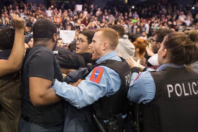 Police break up skirmishes between demonstrators and supporters of  Donald Trump. Picture: Getty