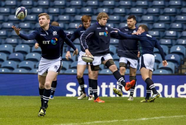 Russell up a win: Scotland stand-off Finn Russell juggles during training on the Murrayfield pitch yesterday.
Photograph: Gary Hutchison/SNS