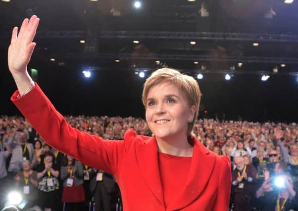 Sturgeon acknowledes the applause after delivering her keynote speech at the annual SNP spring conference at the SECC in Glasgow yesterday. Picture: Jane Barlow