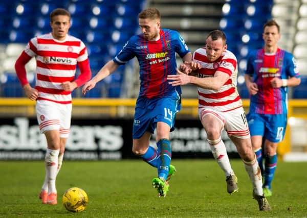 Danny Devine battles with Hamilton's Darian MacKinnon. Picture: SNS Group