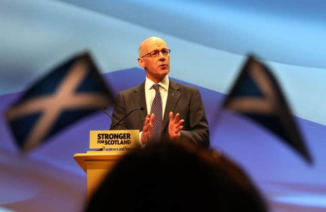 John Swinney speaks at the SNP spring conference at the SECC in Glasgow yesterday. He says the party will fight hard to win every seat it contests. Picture: PA