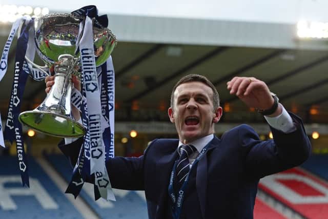 Jim McIntyre lifts the League Cup Trophy. Picture: Getty