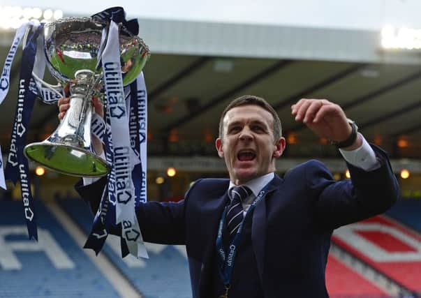 Jim McIntyre lifts the League Cup Trophy. Picture: Getty