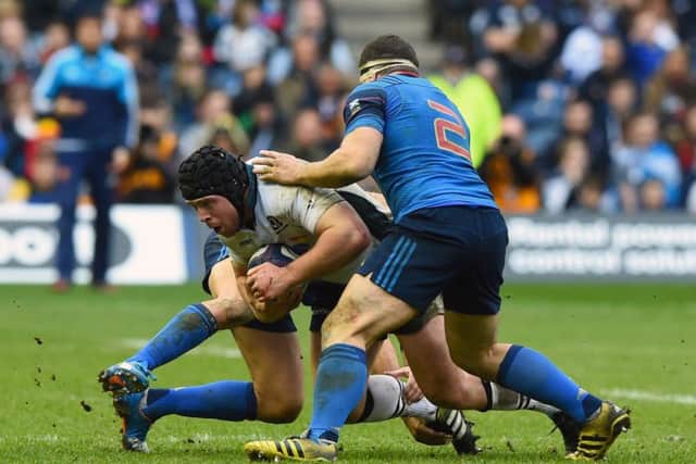 Loosehead prop Alasdair Dickinson makes some more hard yards during Scotlands impressive win at Murrayfield on Sunday. Picture: SNS