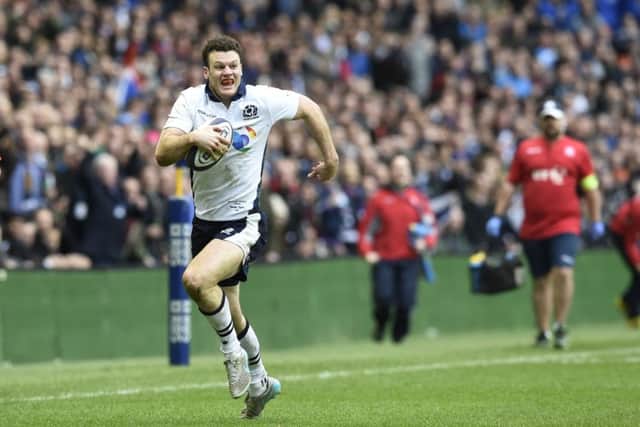 Duncan Taylor runs through to score Scotland's second try. Picture: Ian Rutherford