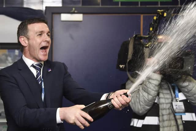 Ross County manager Jim McIntyre celebrates in the Hampden dressing room. Picture: Rob Casey/SNS