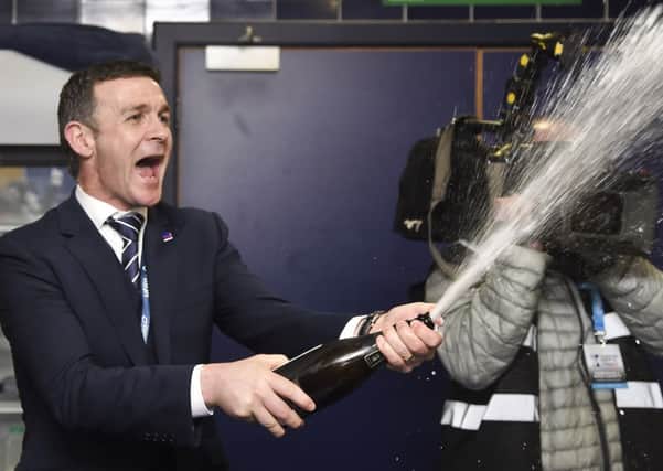 Ross County manager Jim McIntyre celebrates in the Hampden dressing room. Picture: Rob Casey/SNS