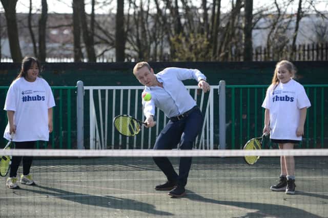 The champion played table tennis and mini tennis with local children as he opened another community sports hub