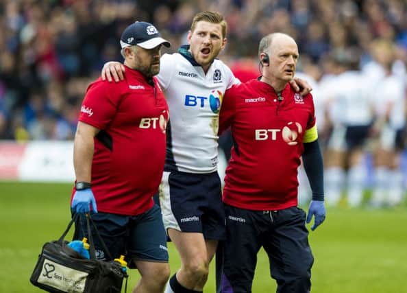 Finn Russell was forced off through injury against France. Picture: SNS