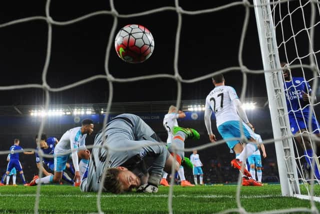 Newcastle goalkeeper Rob Elliot looks back to see Shinji Okazaki's shot hit the net. Picture: Getty