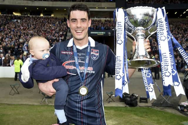 Brian Graham celebrates after helping Ross County to win the League Cup. Picture: SNS
