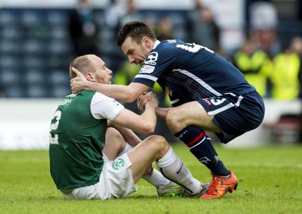 Paul Quinn shakes the hand of Hibs' David Gray at full-time in the League Cup final. Picture: SNS