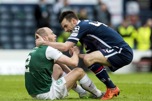 Paul Quinn shakes the hand of Hibs' David Gray at full-time in the League Cup final. Picture: SNS