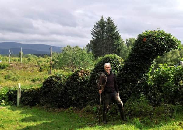 Alex Sutherland has sculpted an eight-metre long, four-metre high beech hedge into the shape of the Loch Ness monster. Picture: Deadline