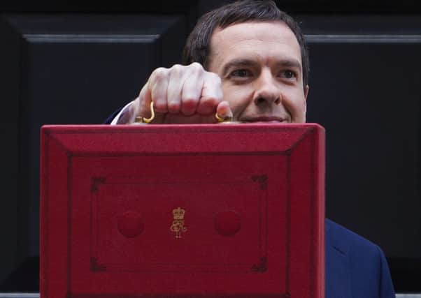 George Osborne on his way to parliament to present the government's annual budget. Picture: AFP/Getty Images