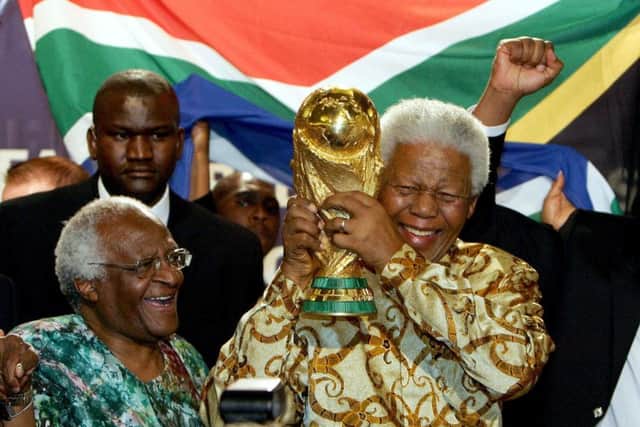 Nelson Mandela with the Jules Rimet Trophy after South Africa was awarded the World Cup in 2010. Picture: AFP/Getty Images