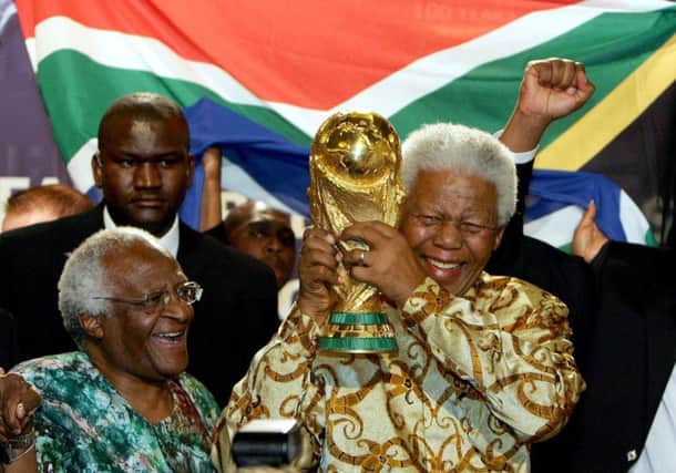 Nelson Mandela with the Jules Rimet Trophy after South Africa was awarded the World Cup in 2010. Picture: AFP/Getty Images