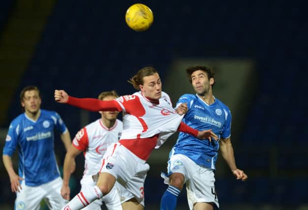St Johnstone's Simon Lappin tugs the shirt of Ross County's Jackson Irvine. Picture: Bill Murray/SNS
