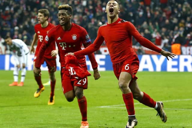 Thiago Alcantara, right, celebrates after scoring Bayern Munich's third goal against Juventus as the Germans claimed a 6-4 aggregate win to reach the last eight. Picture: AP