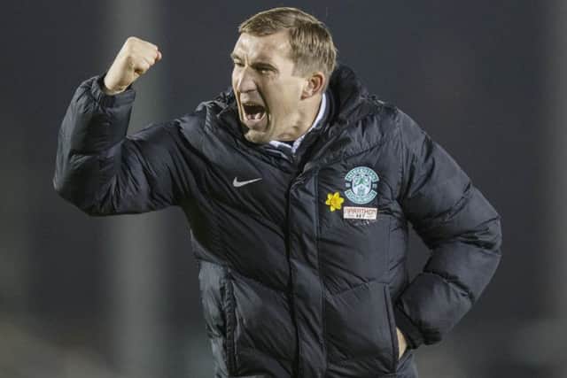 Alan Stubbs celebrates after Hibs finally got back to winning ways. Picture: Steve Welsh