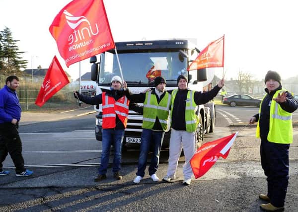 Striking Forth Ports workers on picket duty at the entrance to the tanker terminal
Picture: Michael Gillen