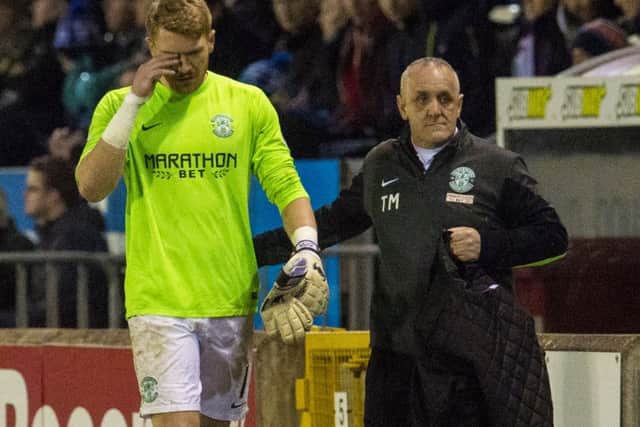Hibs goalkeeper Mark Oxley was substituted after losing a contact lens. Picture: Craig Foy/SNS